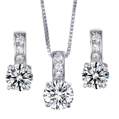 Introducing our Silver-Tone Zirconia Necklace with Matching Earrings, a captivating and versatile jewellery set that exudes timeless beauty and sophistication. This exquisite ensemble combines the elegance of silver-tone metal with the dazzling sparkle of zirconia stones, ensuring you shine with every step you take. Crafted with meticulous attention to detail, our Silver-Tone Zirconia Necklace and Earrings Set features a design that radiates sophistication and charm. The necklace showcases a delicate chain adorned with brilliant zirconia stones, while the earrings mirror this brilliance with their own zirconia stone accents. Securing the necklace is effortless, thanks to its reliable clasp, ensuring it elegantly rests around your neck. The earrings are designed for ease of wear, with secure fastenings that make them comfortable to adorn. Whether you're preparing for a special occasion or adding a touch of glamour to your everyday look, this set is the perfect choice. Its classic design and high-quality materials guarantee it becomes a cherished part of your jewellery collection. For all the ladies who appreciate the allure of coordinated sets and desire versatile accessories that effortlessly complement various outfits, our Silver-Tone Zirconia Necklace and Earrings Set is a must-have. It not only exudes timeless elegance but also adds a touch of brilliance and glamour to your style. To complete your ensemble and explore more jewellery pieces that coordinate seamlessly with this set, be sure to visit Juwelia's webshop. From bracelets and rings to anklets, we offer a range of options to enhance your style and embrace the captivating charm of zirconia-studded jewellery. Elevate your elegance with the stunning Silver-Tone Zirconia Necklace and Earrings Set today!